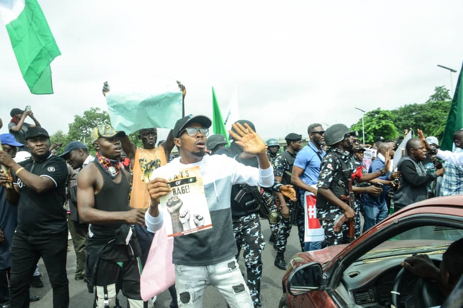 Protesters shout down Minister, as mother holding baby confronts police at Eagle Square